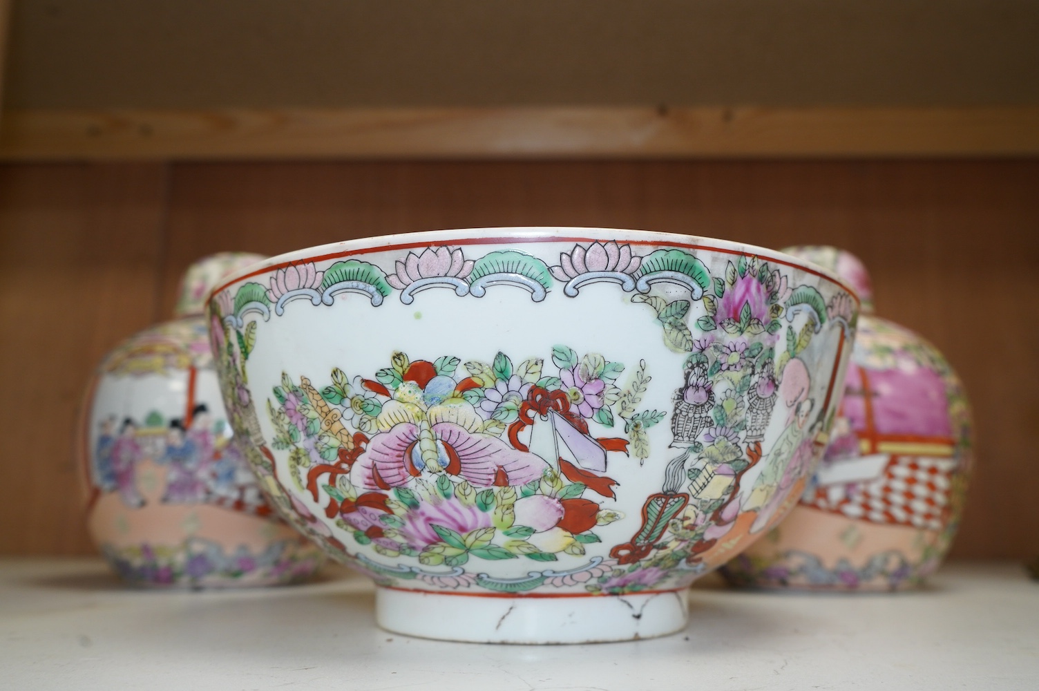 A 20th century Chinese famille rose bowl and a pair of jars and covers, bowl 26cm diameter. Condition - good